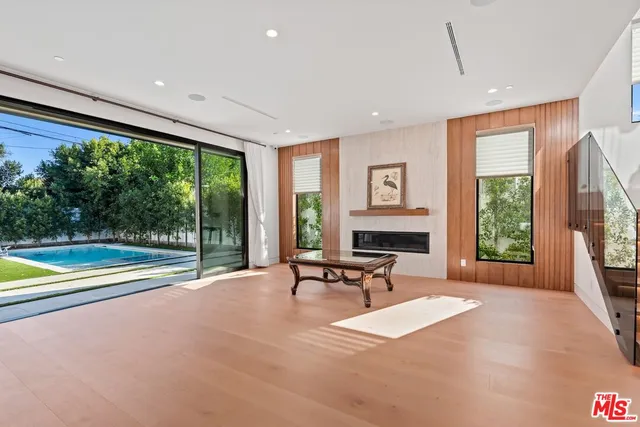 a white bath tub sitting next to a white sink