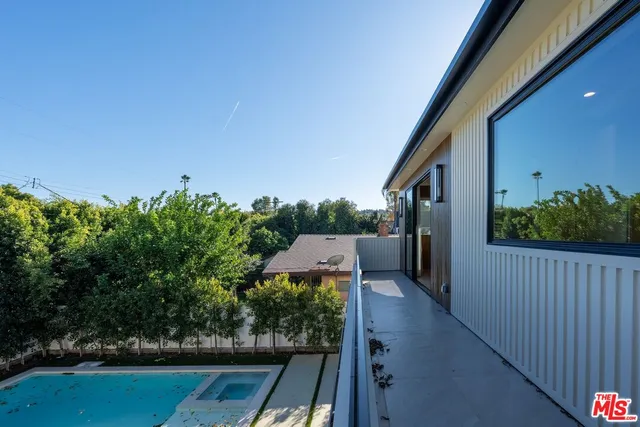 a view of a house with a yard and a garden