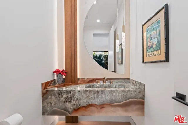 a view of an empty room with a fireplace and a large window