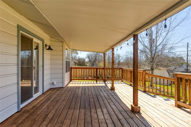 a view of balcony with wooden floor