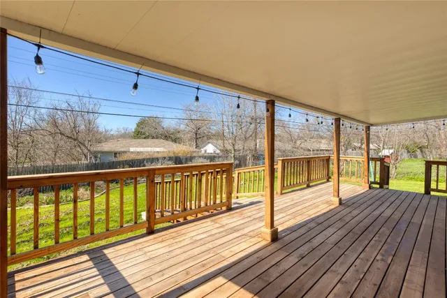 a view of a balcony with wooden floor