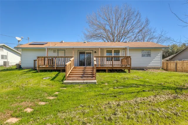 a front view of a house with a yard table and chairs