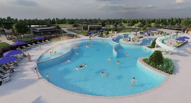a view of a swimming pool with outdoor seating and city view