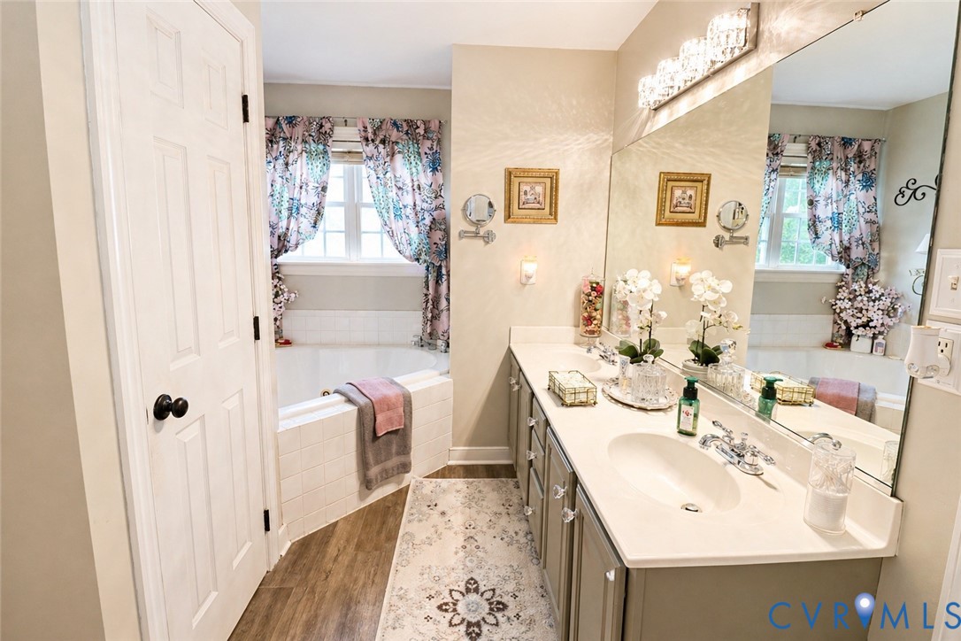 13818 Hawkins Park Road Midlothian, VA 23114 - Photo 15 of 28 Dual vanity with integrated sinks, framed by a lar