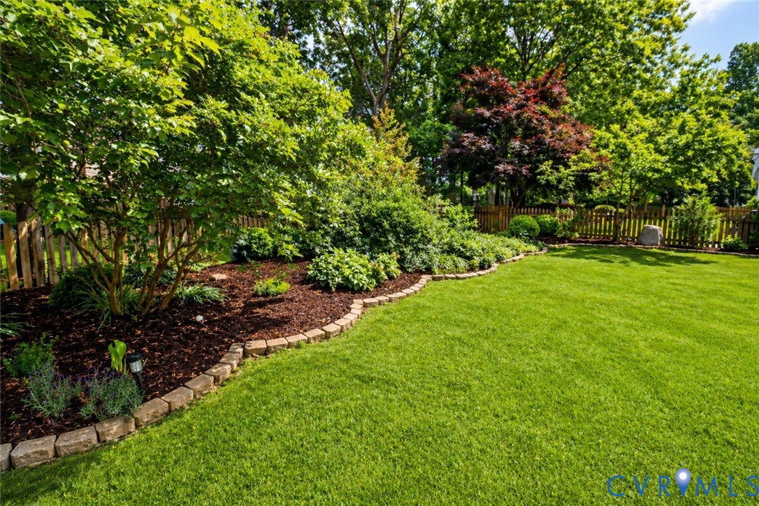 13818 Hawkins Park Road Midlothian, VA 23114 - Photo 26 of 28 Expansive lawn bordered by a landscaped garden bed