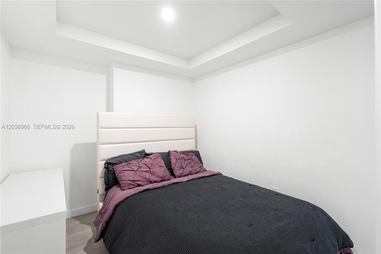 55 Southwest 9th Street, Unit 1904 Miami, FL 33130 - Photo 22 of 66 a bedroom with a bed and a window