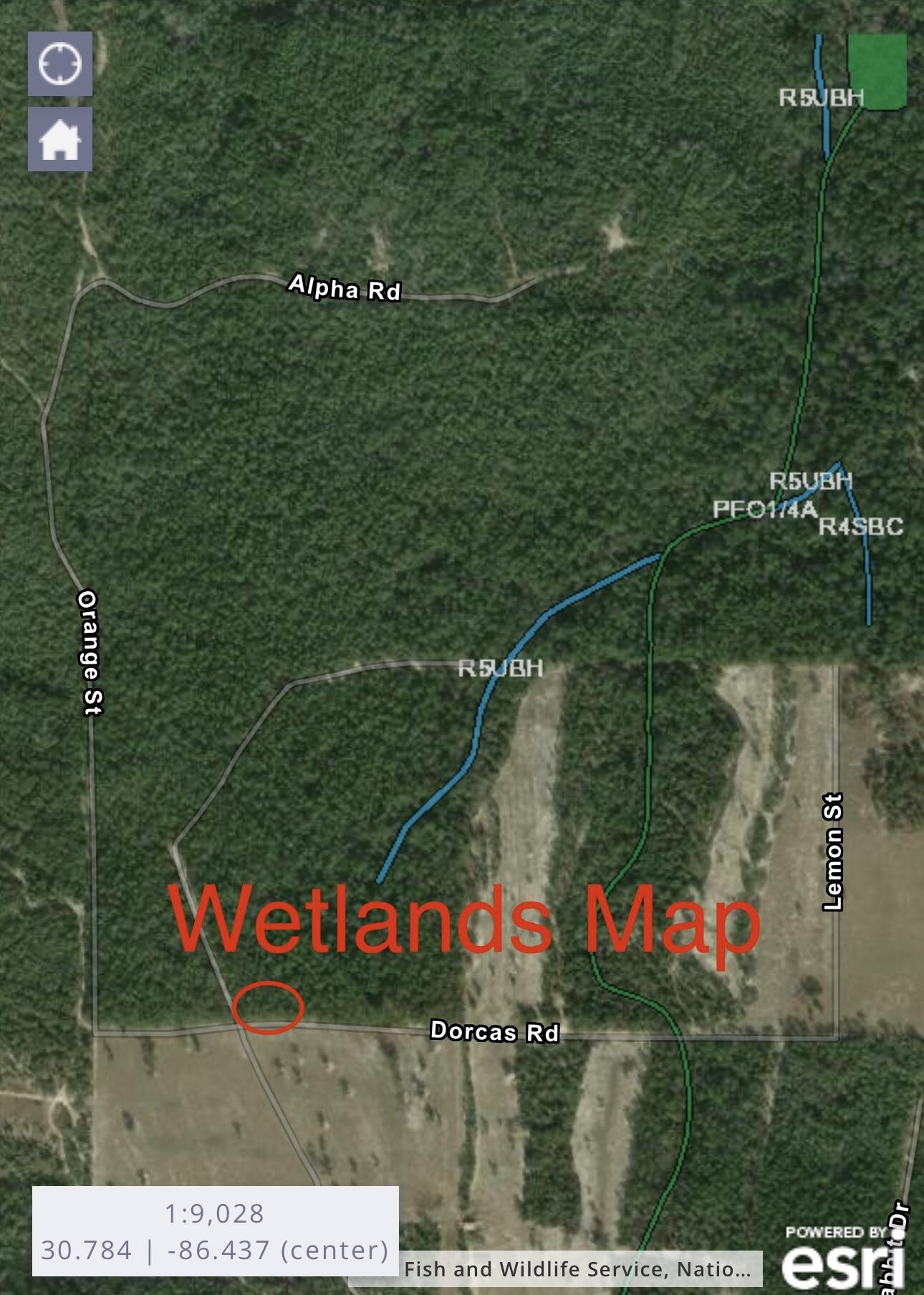 1-2 Dorcas Road Crestview, FL 32539 - Photo 4 of 5 a sign that is sitting on a lush green field