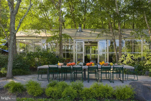 a bathroom with a granite countertop toilet sink and mirror
