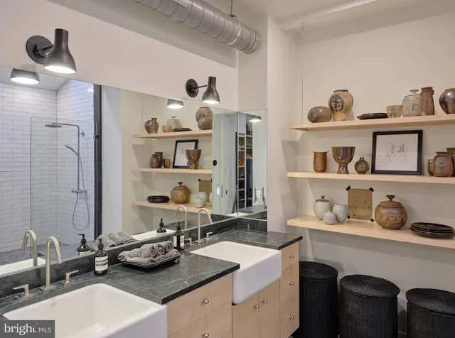 a aerial view of a residential houses with yard