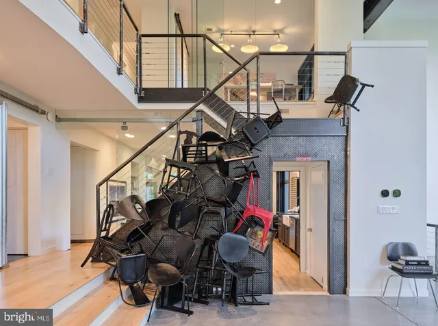 a kitchen with a table chairs stove and wooden floor
