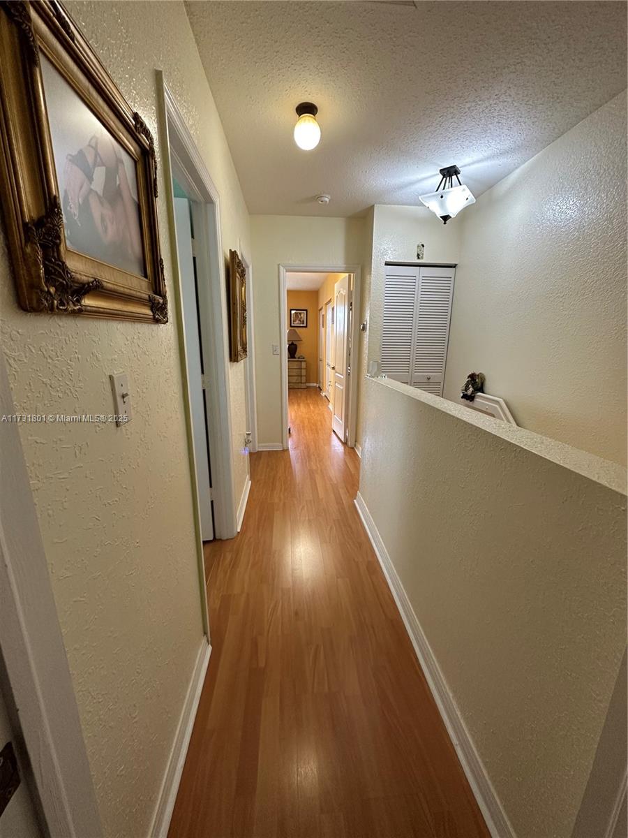 425 East 3rd Avenue, Unit 6 Hialeah, FL 33010 - Photo 13 of 24 a view of gallery with wooden floor