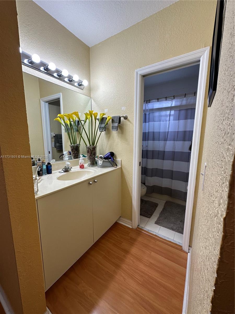 425 East 3rd Avenue, Unit 6 Hialeah, FL 33010 - Photo 20 of 24 a view of walk in closet with clothes and shoes