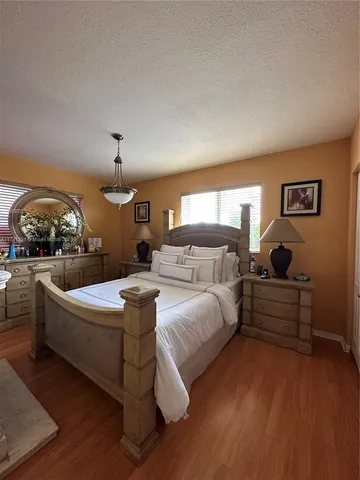 a bed room with bed and window