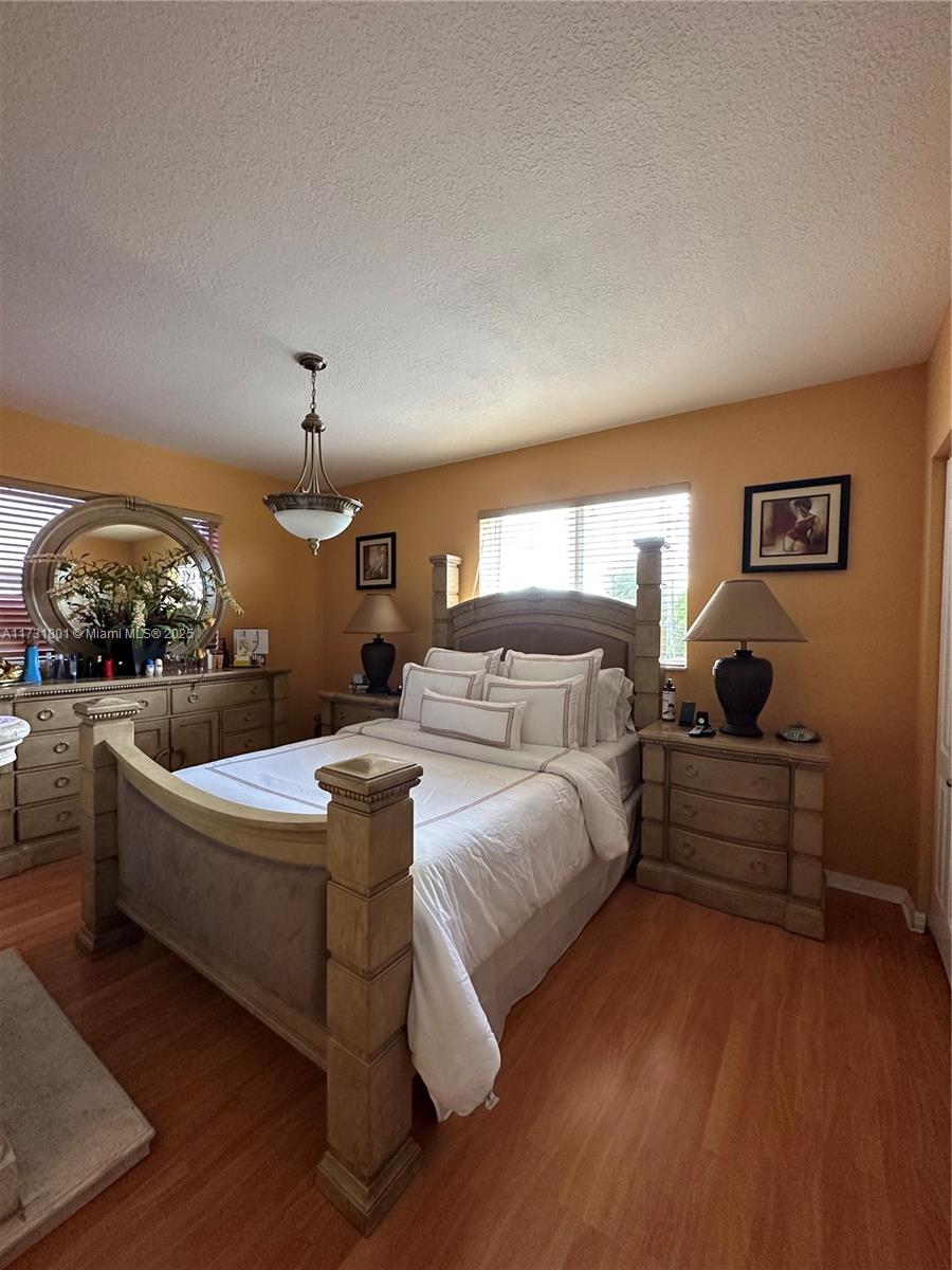 425 East 3rd Avenue, Unit 6 Hialeah, FL 33010 - Photo 23 of 24 a bed room with bed and window