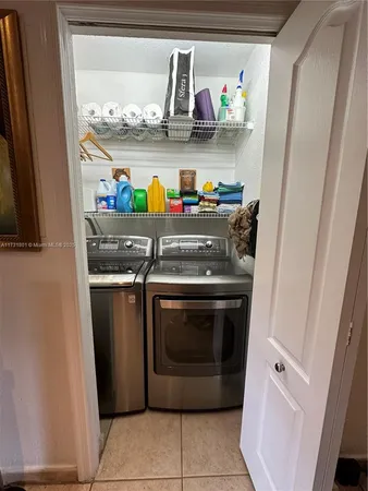 a utility room with washer and dryer