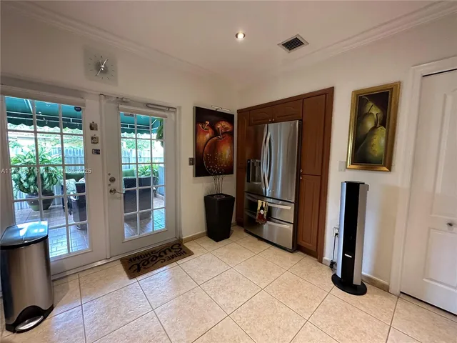 a kitchen with stainless steel appliances granite countertop a refrigerator and a sink
