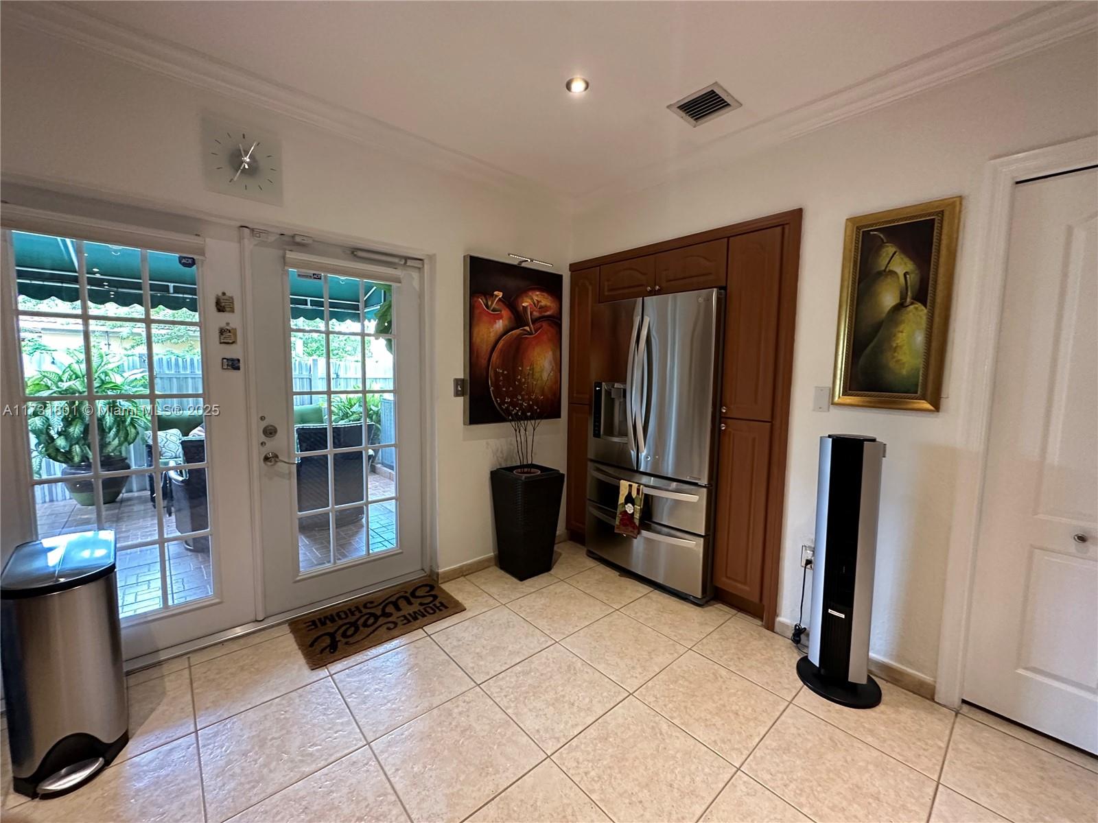 425 East 3rd Avenue, Unit 6 Hialeah, FL 33010 - Photo 8 of 24 a kitchen with stainless steel appliances granite countertop a refrigerator and a sink