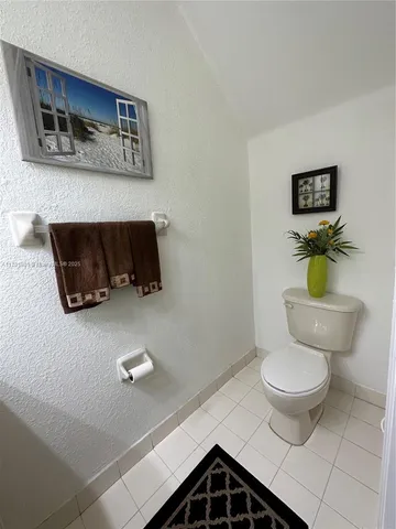 a bathroom with a toilet and a sink