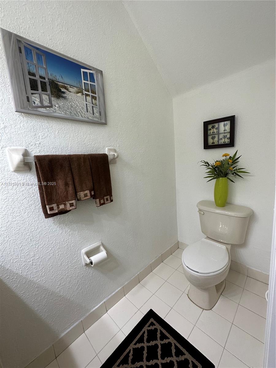 425 East 3rd Avenue, Unit 6 Hialeah, FL 33010 - Photo 10 of 24 a bathroom with a toilet and a sink