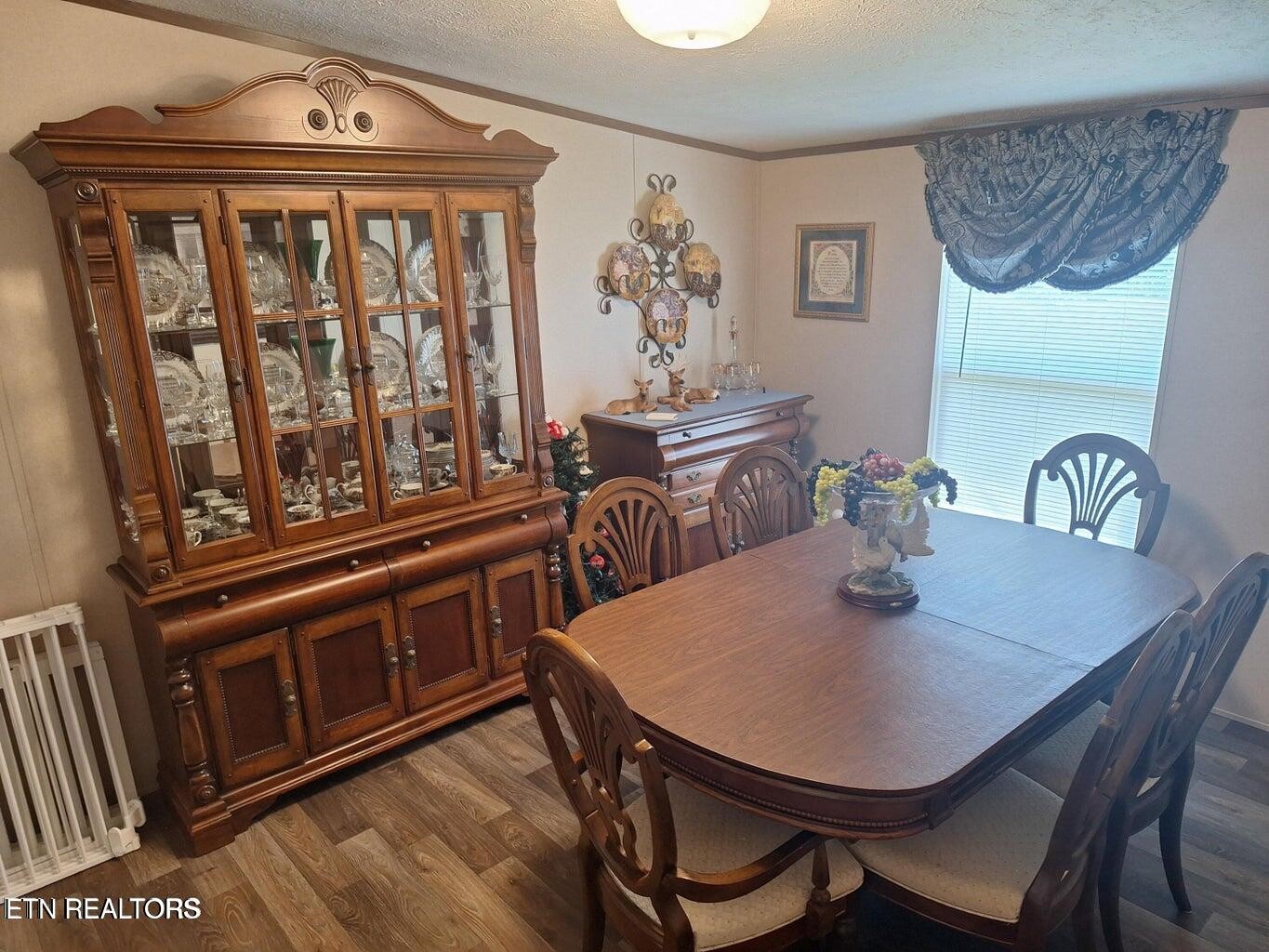 1450 Belltown Road Tellico Plains, TN 37385 - Photo 23 of 32 a view of a dining room with furniture window and wooden floor