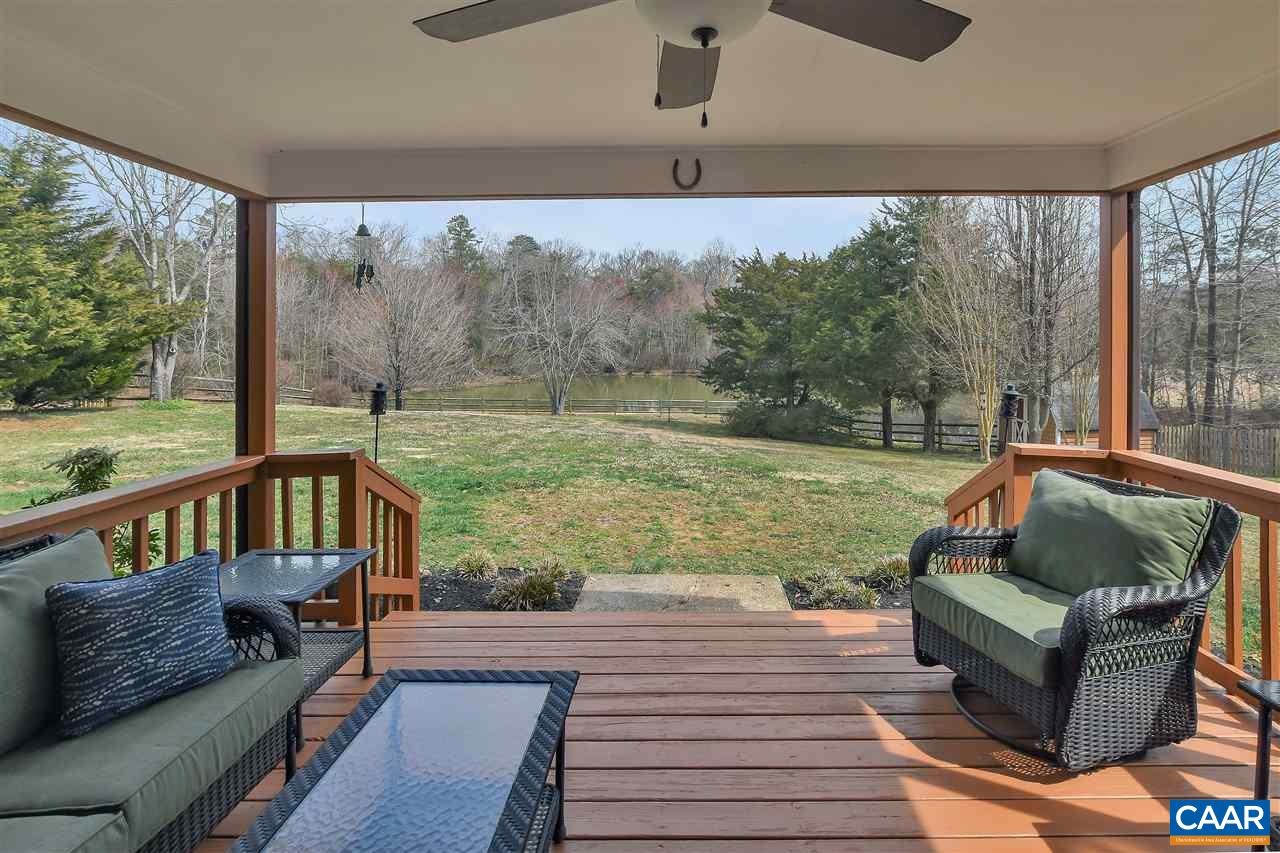 142 Rolling Hills Road Ruckersville, VA 22968 - Photo 34 of 47 a balcony with wooden floor and outdoor seating