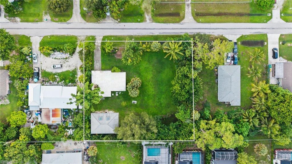 2670 Storter Avenue Naples, FL 34112 - Photo 11 of 11 an aerial view of a house with a garden