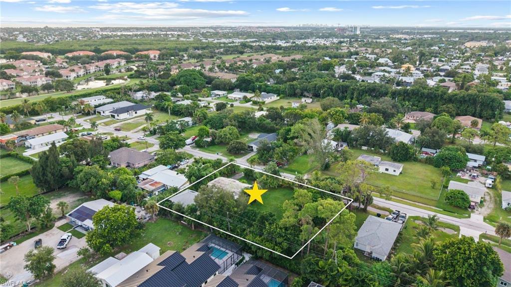 2670 Storter Avenue Naples, FL 34112 - Photo 5 of 11 an aerial view of multiple house