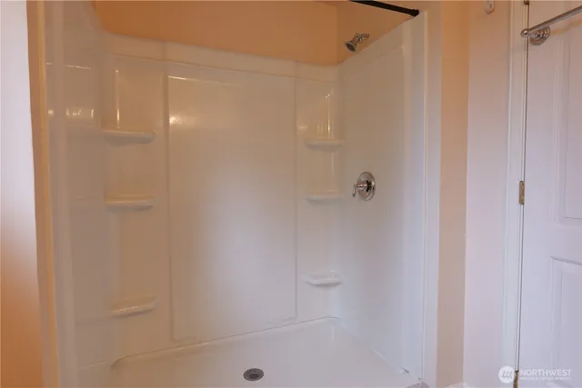 a view of a lake with trees in the background