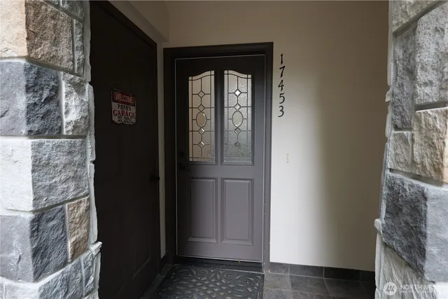 a view of a hallway with wooden door