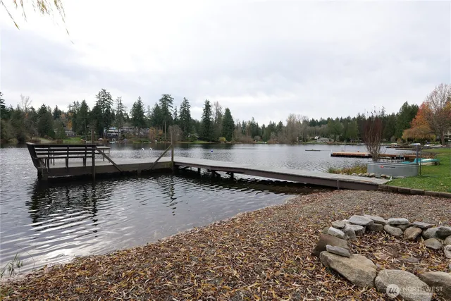 a view of a patio with table and chairs and potted plants