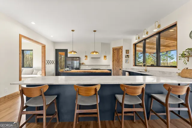 a living room with furniture and large window