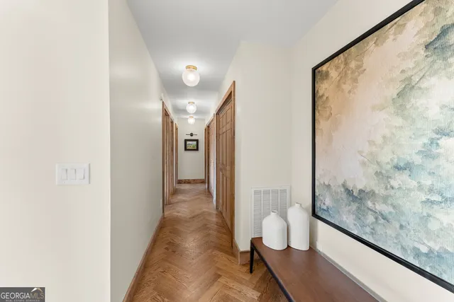 a spacious bathroom with a glass shower door and a bathtub