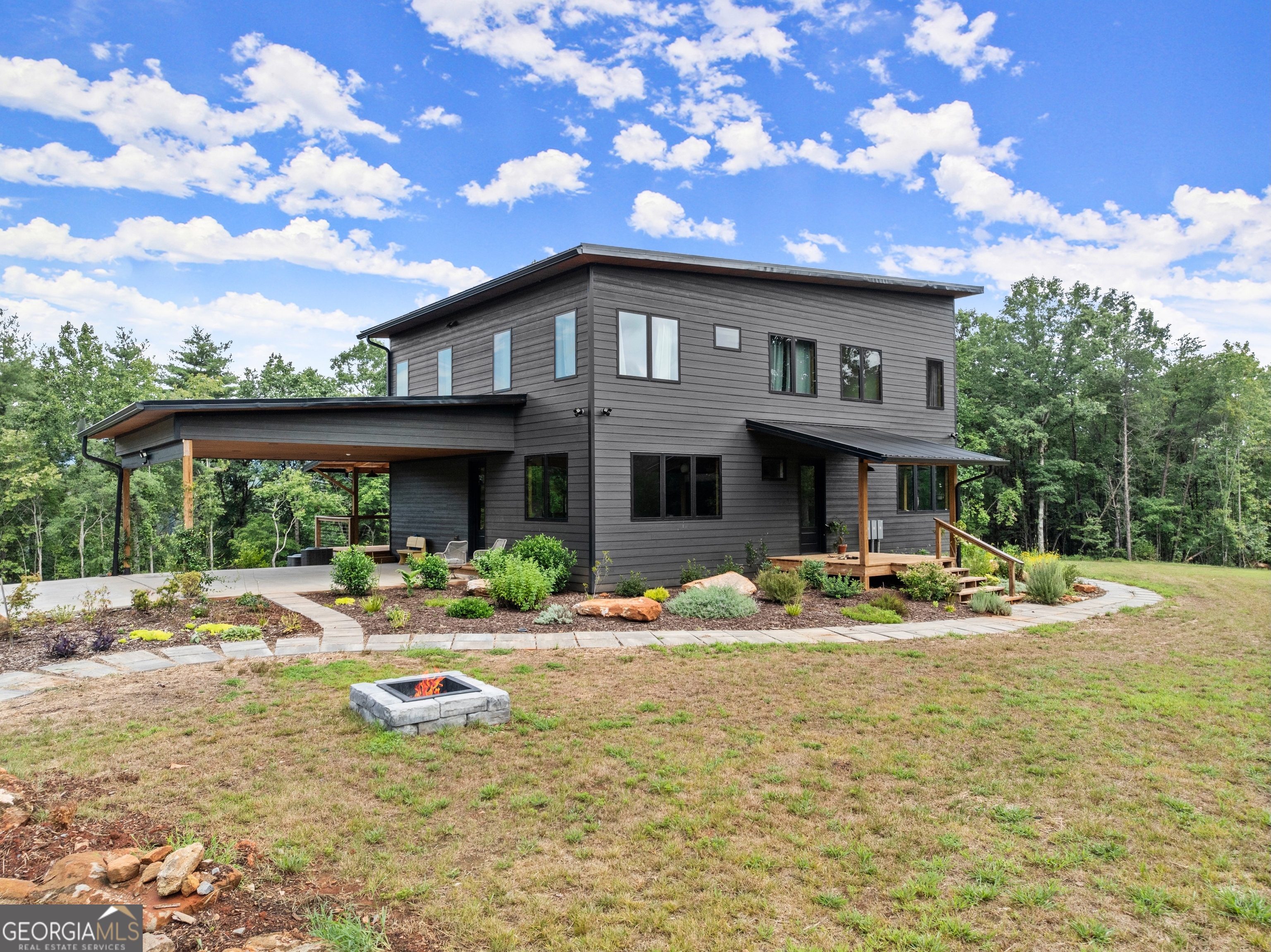 147 Jess Hunt W 60 Acres Road Cleveland, GA 30528 - Photo 3 of 69 a front view of a house with swimming pool and porch with furniture