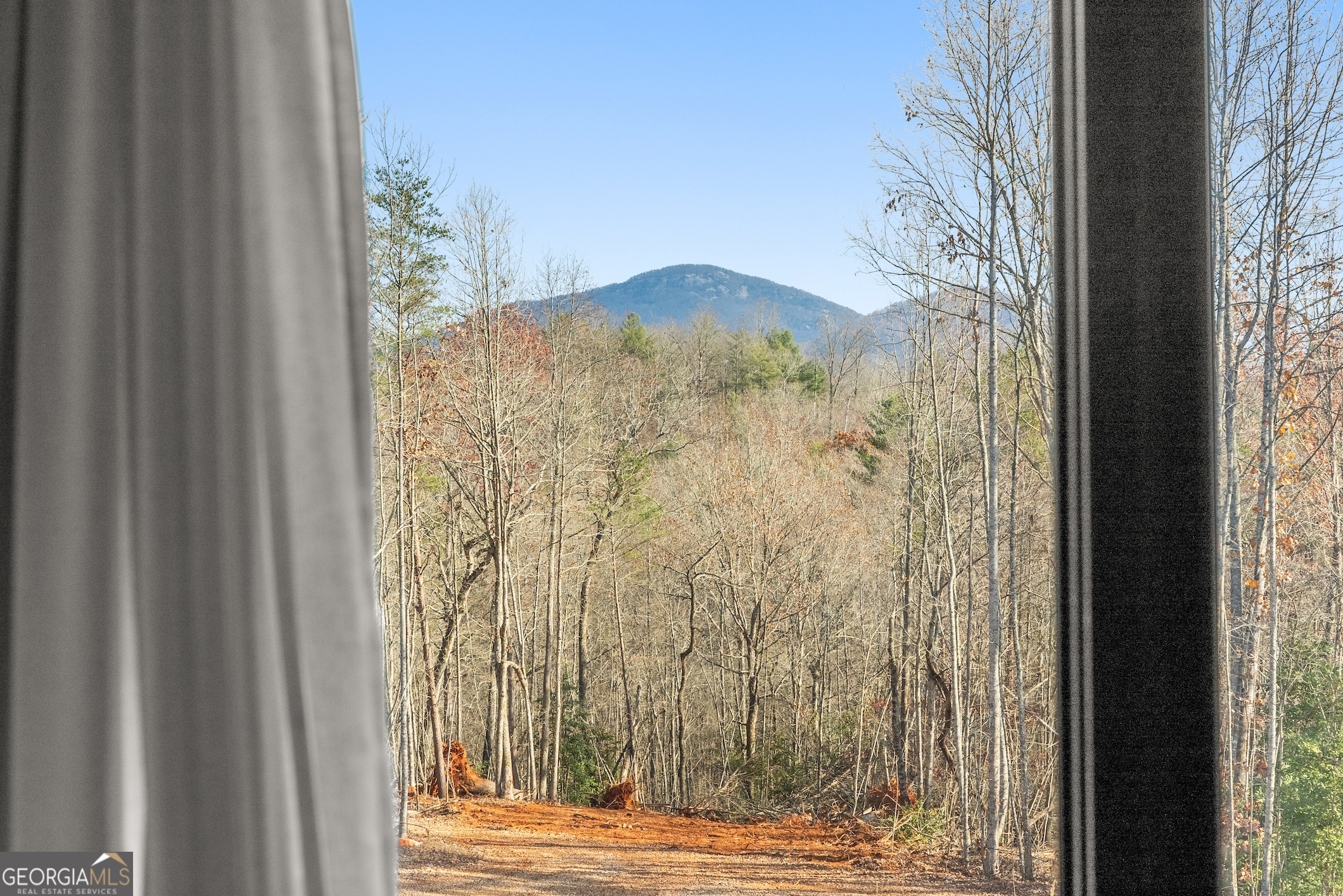 147 Jess Hunt W 60 Acres Road Cleveland, GA 30528 - Photo 33 of 69 a view of a door and chair in a window