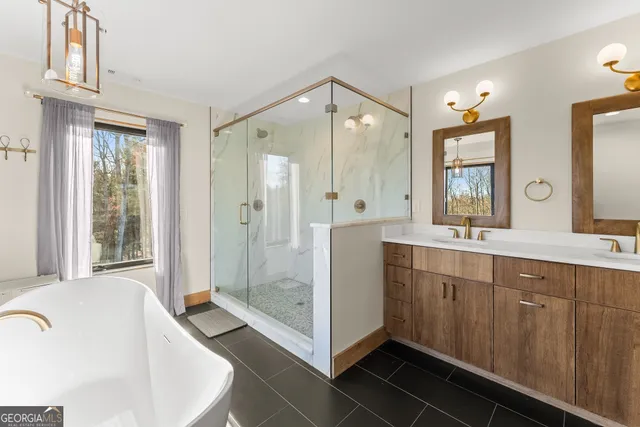 a bedroom with furniture and a large window