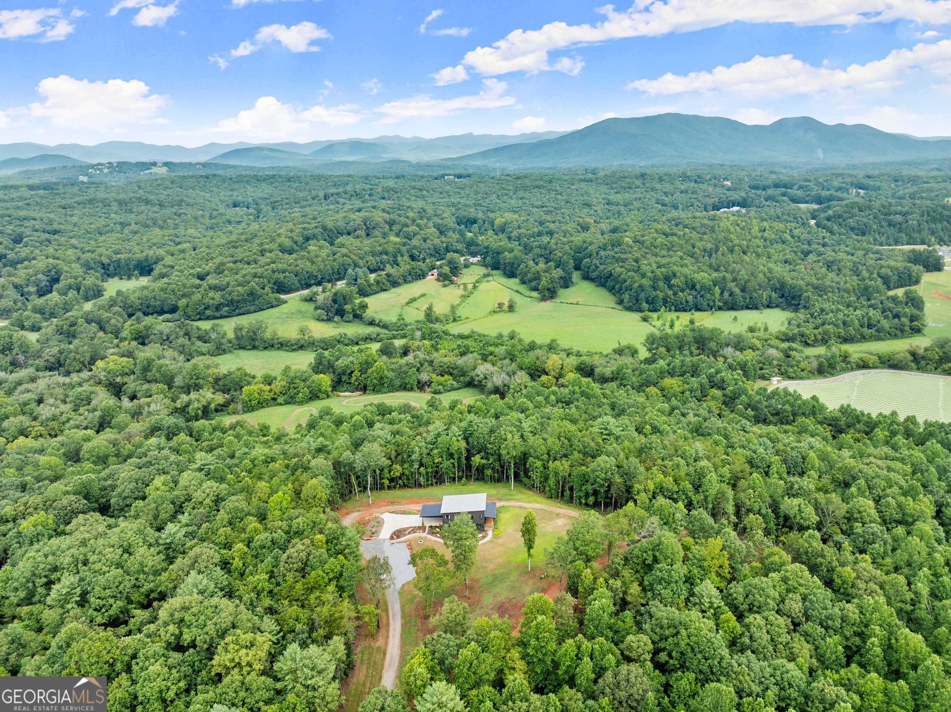 147 Jess Hunt W 60 Acres Road Cleveland, GA 30528 - Photo 59 of 69 a view of a lush green forest with a mountain