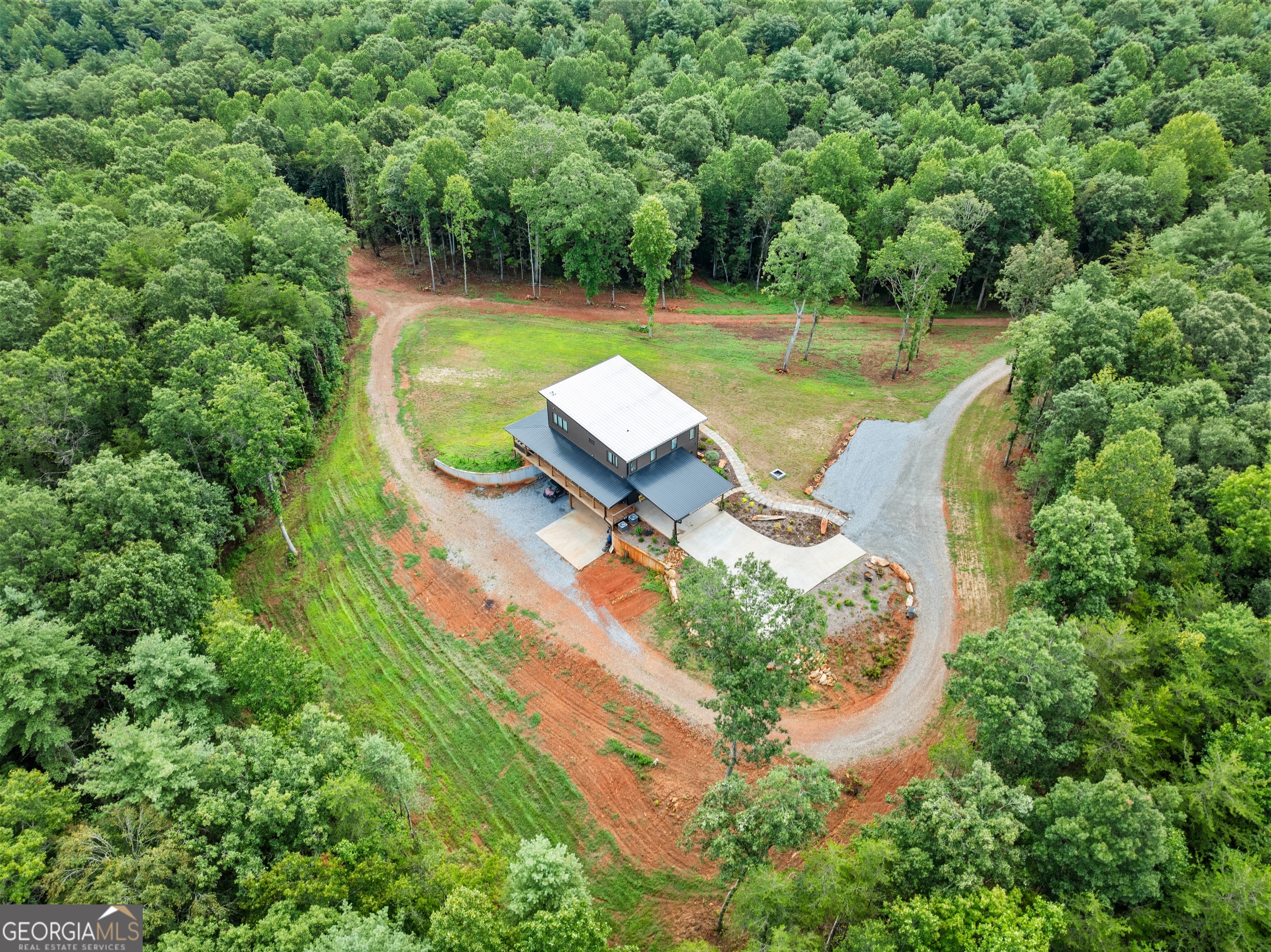 147 Jess Hunt W 60 Acres Road Cleveland, GA 30528 - Photo 61 of 69 an aerial view of a house with swimming pool a yard and lake view