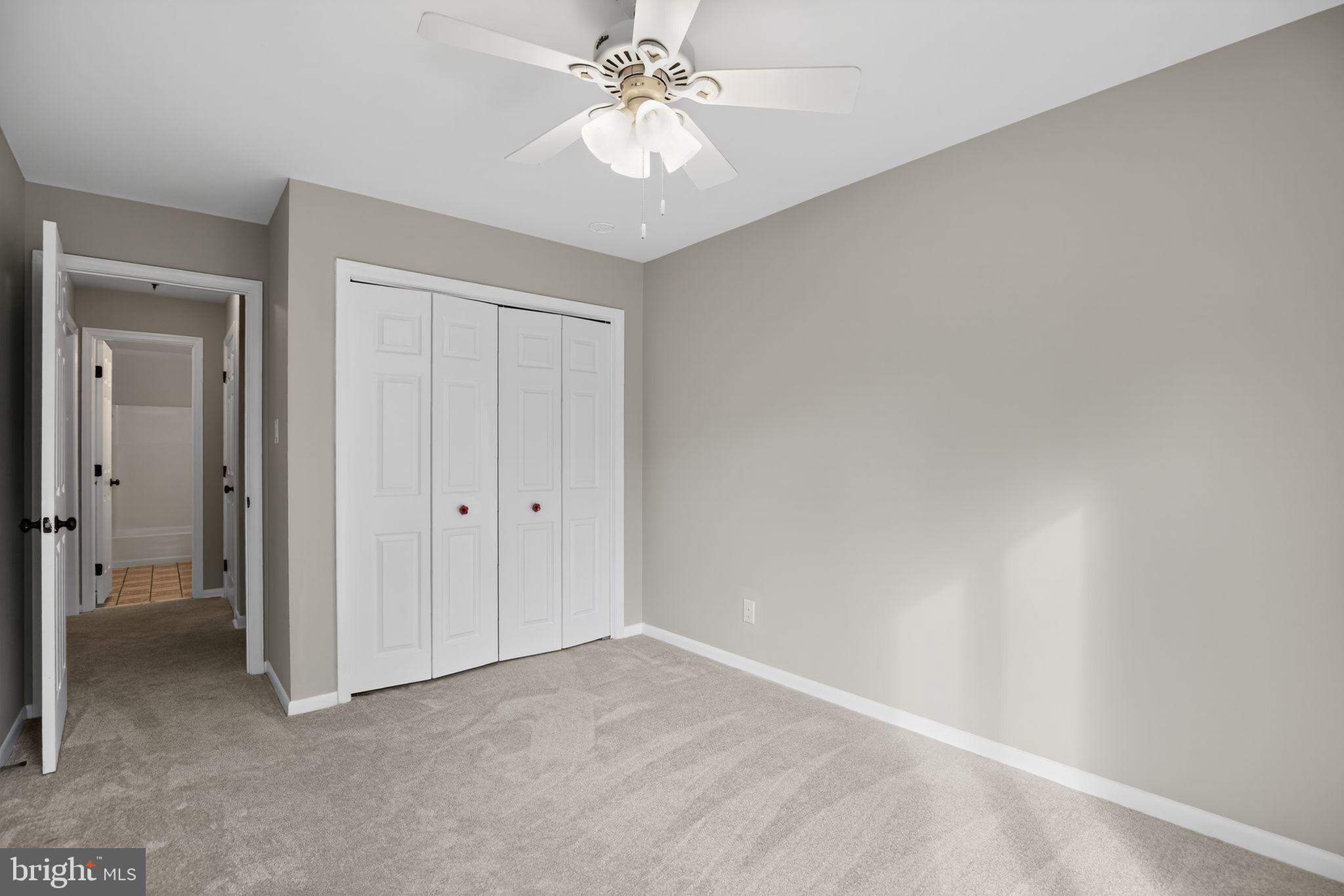 40855 Spring House Lane Leonardtown, MD 20650 - Photo 18 of 68 a view of an empty room and chandelier fan