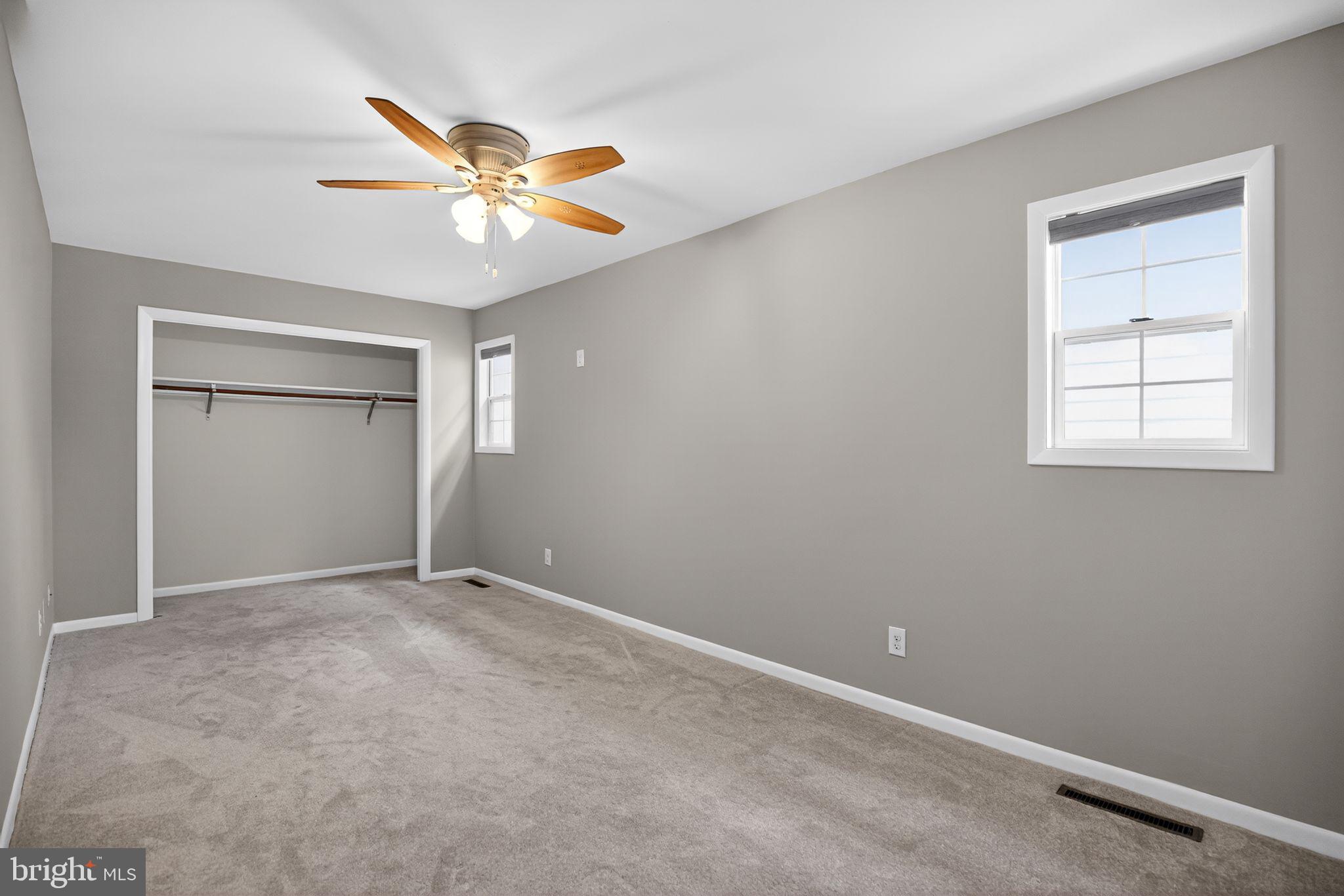 40855 Spring House Lane Leonardtown, MD 20650 - Photo 20 of 68 an empty room with windows and fan