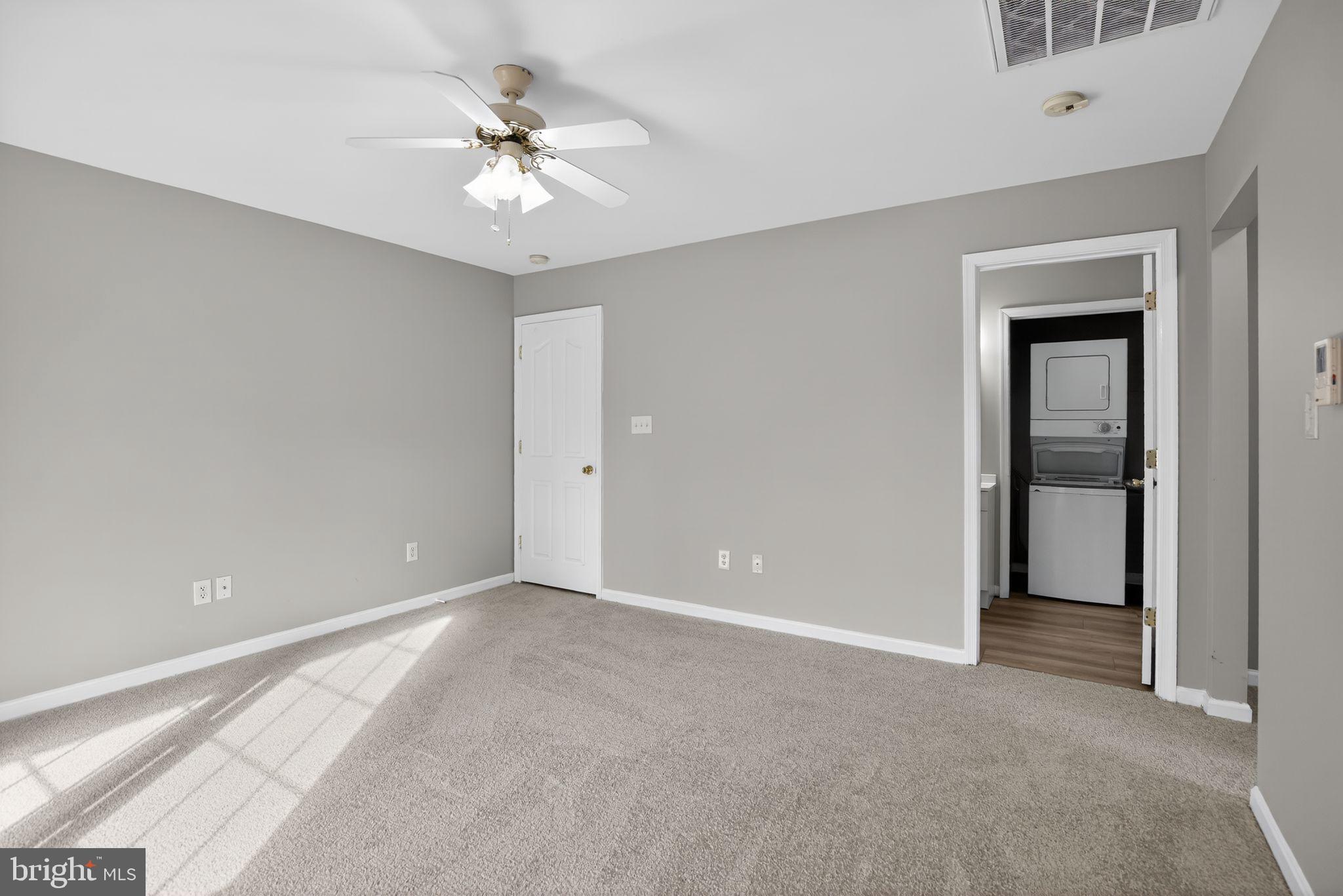 40855 Spring House Lane Leonardtown, MD 20650 - Photo 43 of 68 a view of an empty room with a ceiling fan