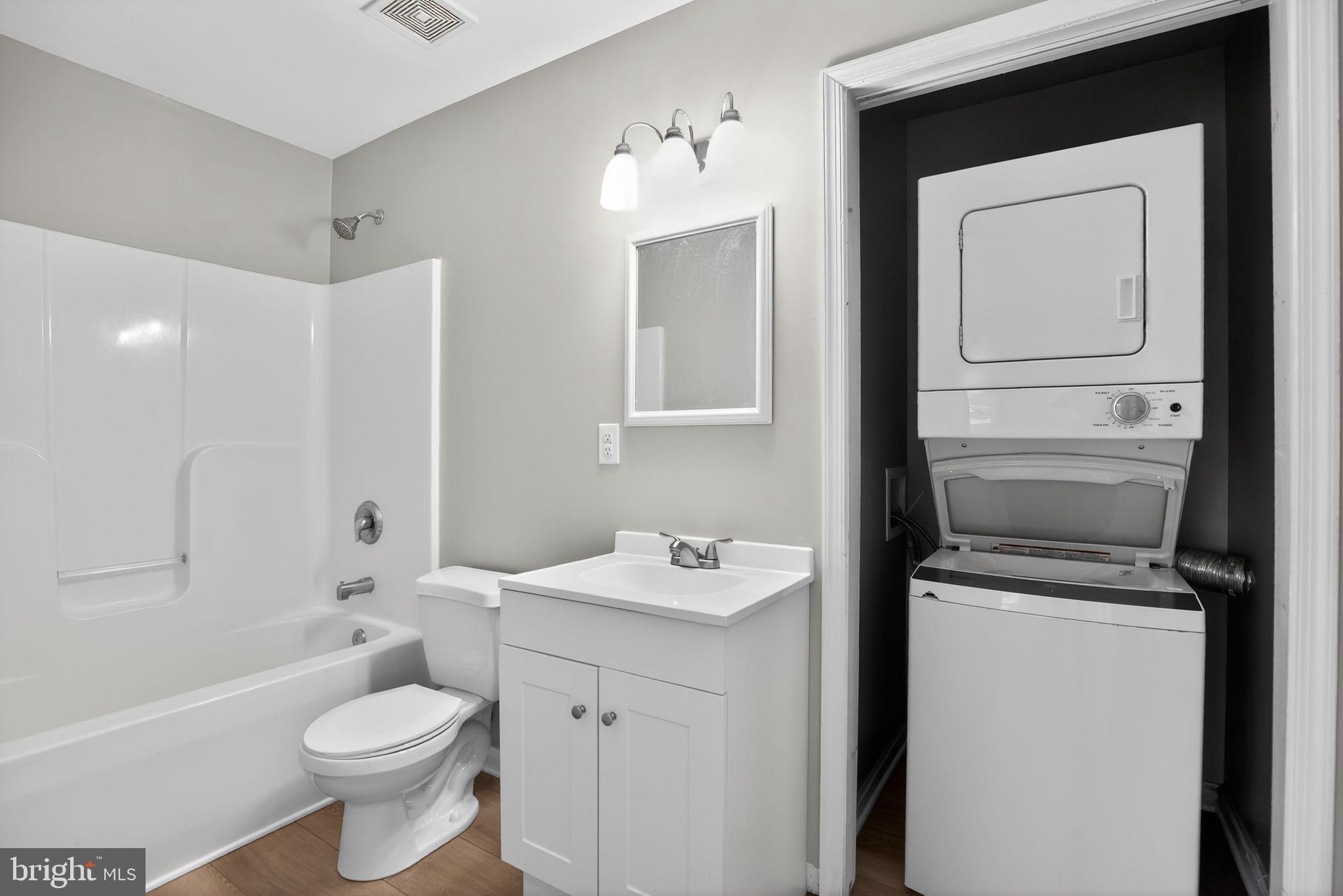 40855 Spring House Lane Leonardtown, MD 20650 - Photo 45 of 68 a bathroom with a sink a toilet and shower