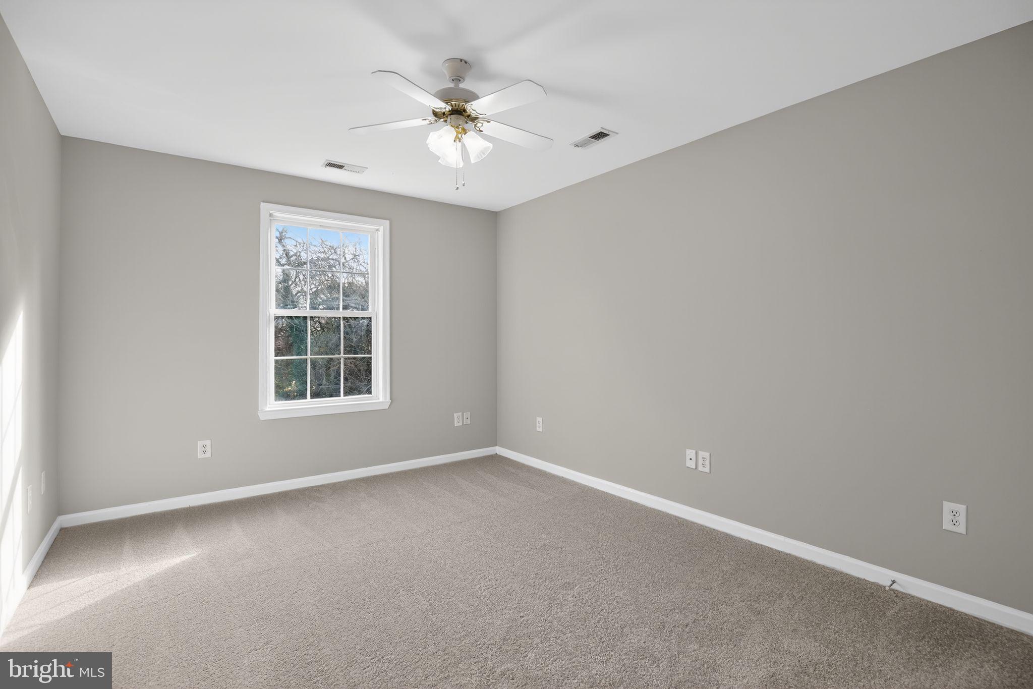 40855 Spring House Lane Leonardtown, MD 20650 - Photo 48 of 68 an empty room with windows and fan