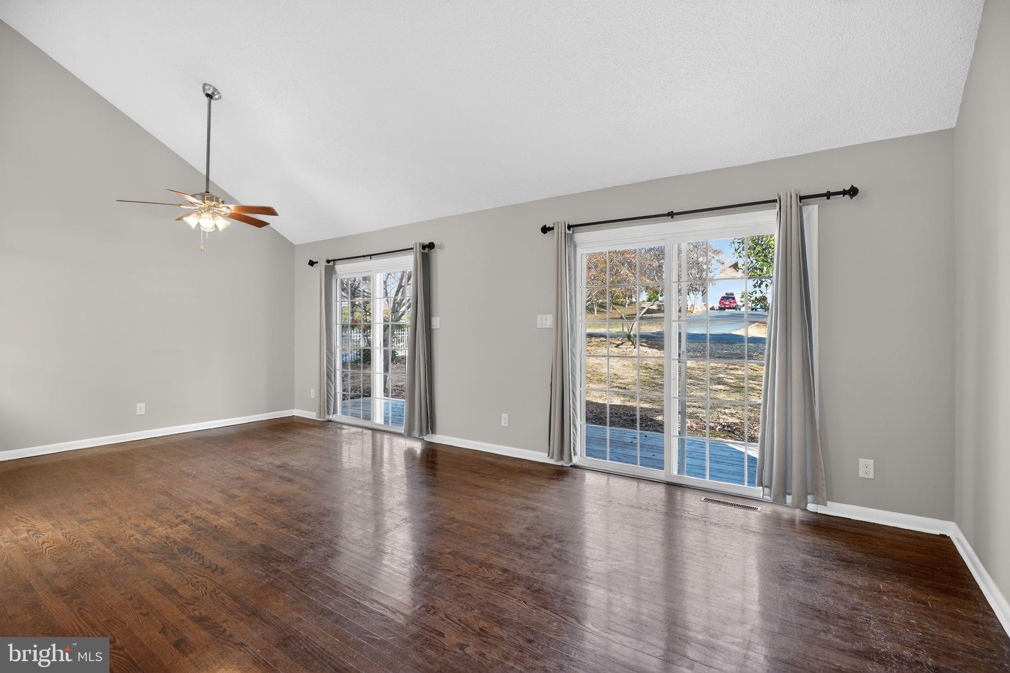 40855 Spring House Lane Leonardtown, MD 20650 - Photo 5 of 68 a view of an empty room with wooden floor and a window