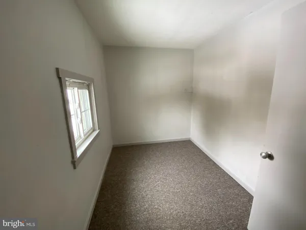 a view of empty room with windows