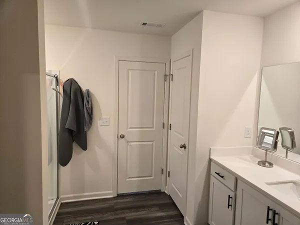 a bathroom with a sink and mirror