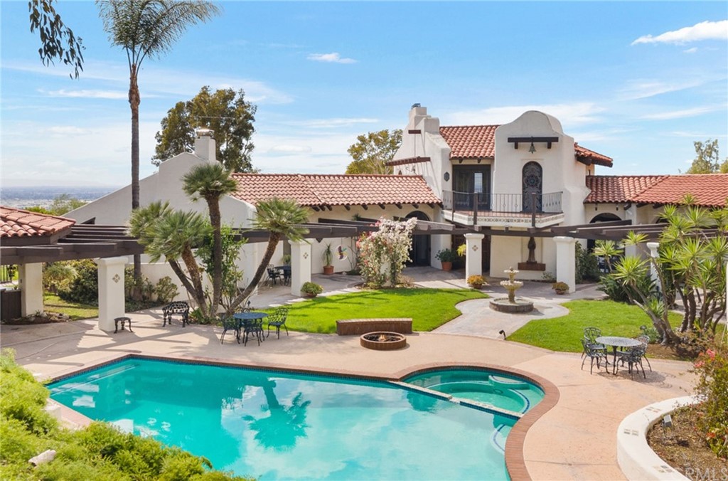 14081 Summit Drive Whittier, CA 90602 - Photo 3 of 61 a view of a house with swimming pool and sitting area