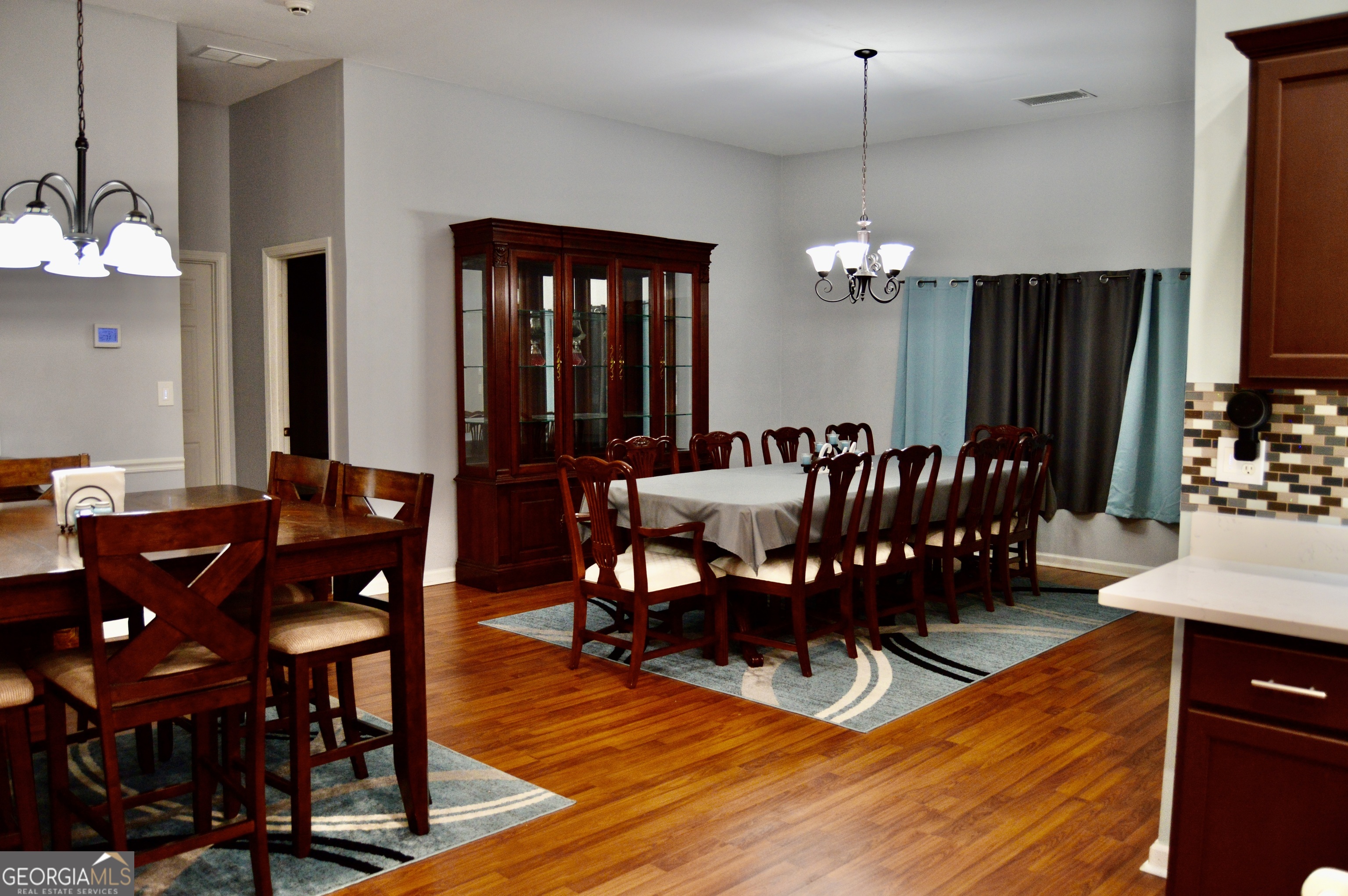 817 Brookside Drive Winder, GA 30680 - Photo 12 of 73 a view of a dining room with furniture and chandelier