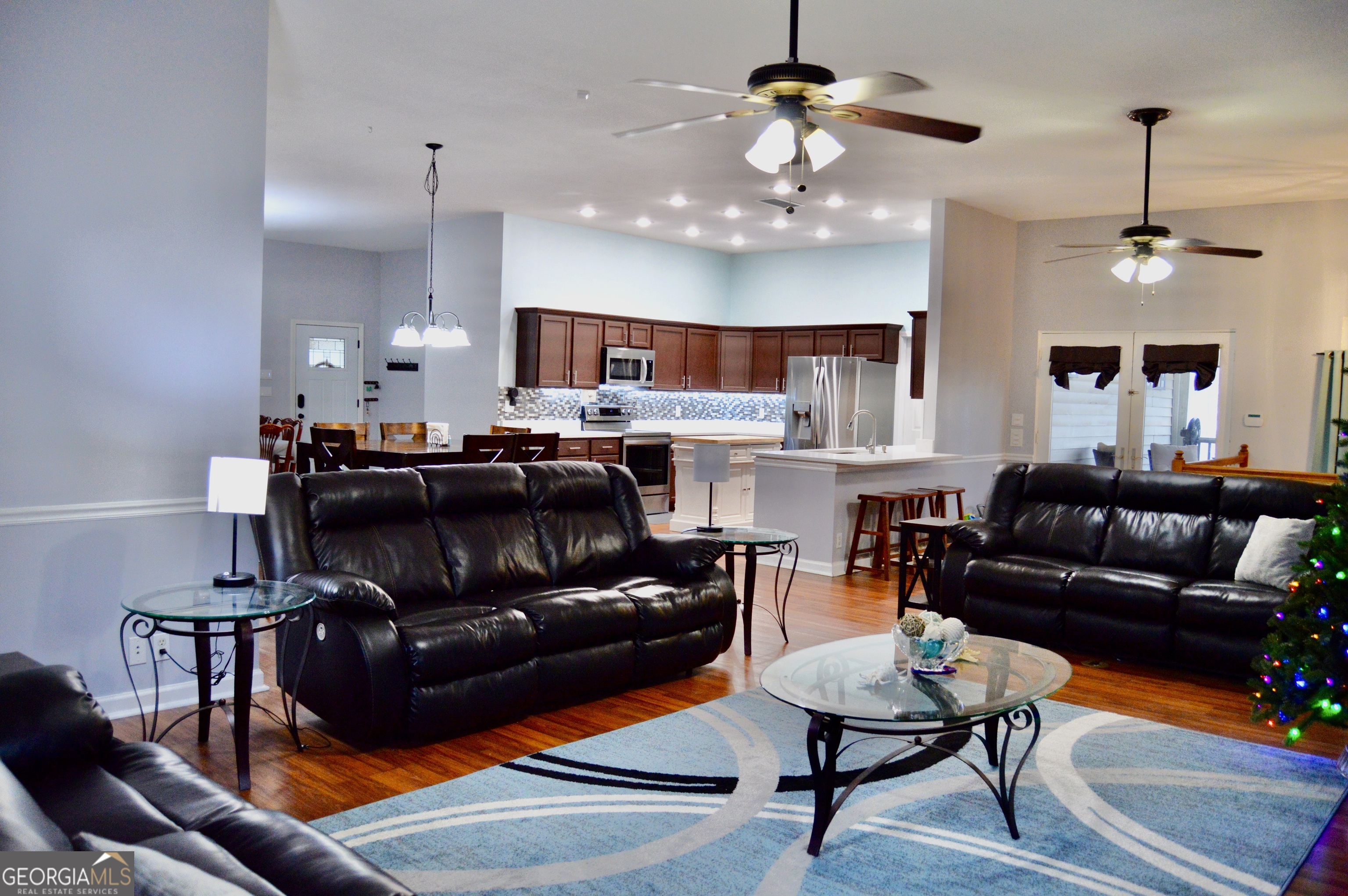 817 Brookside Drive Winder, GA 30680 - Photo 2 of 73 a living room with furniture kitchen view and a chandelier