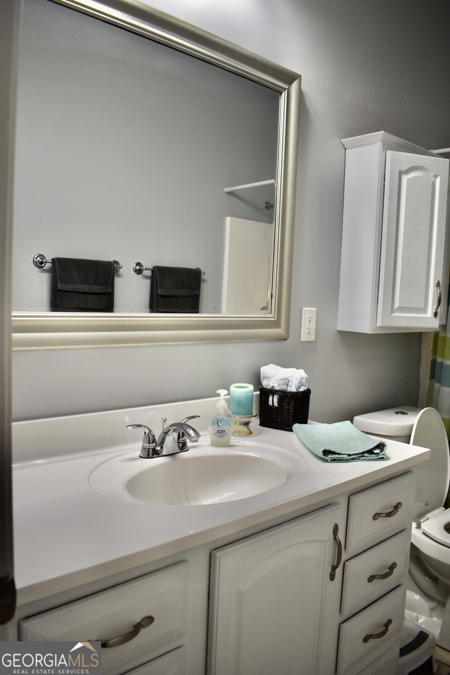 817 Brookside Drive Winder, GA 30680 - Photo 36 of 73 a bathroom with a sink and a mirror