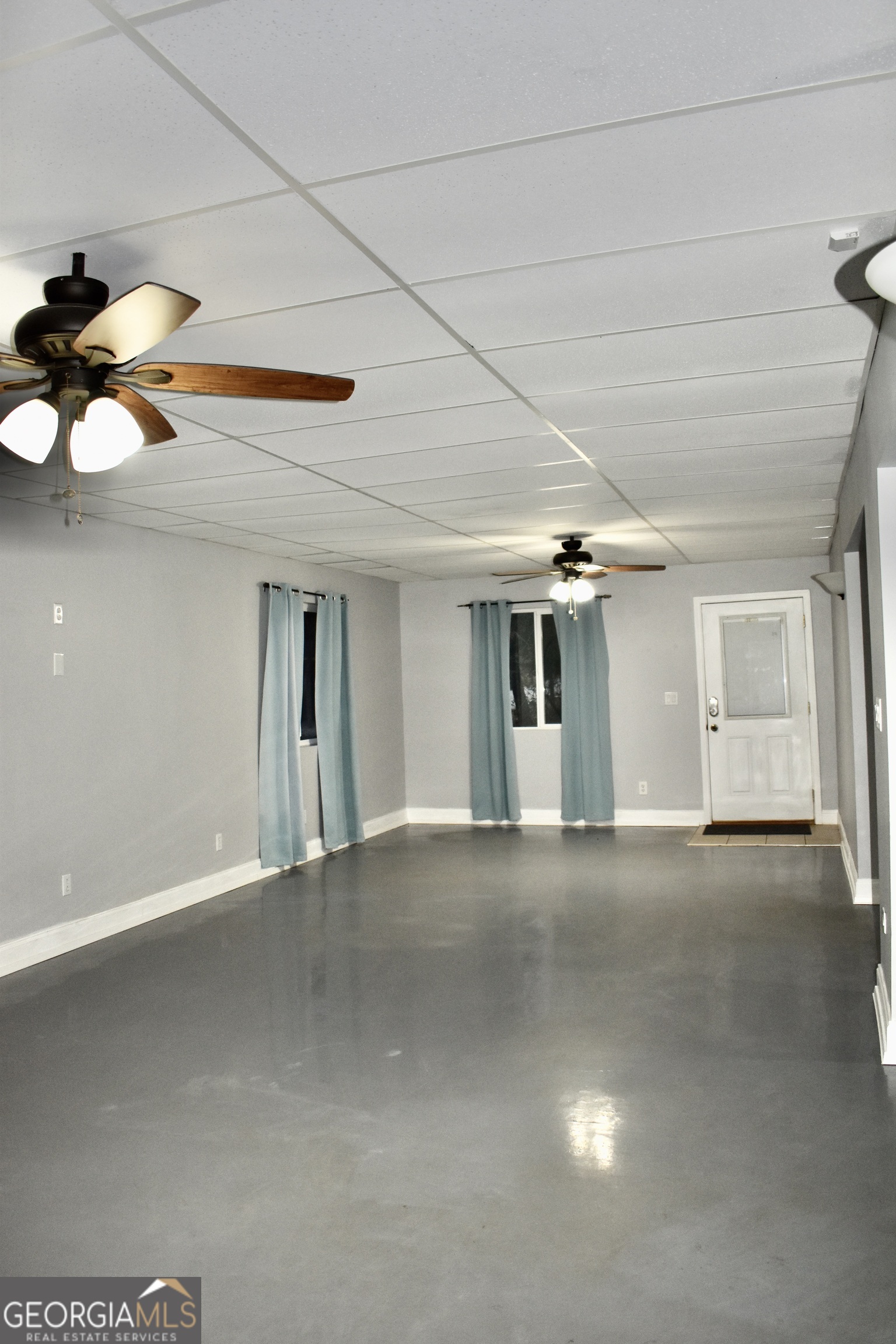 817 Brookside Drive Winder, GA 30680 - Photo 56 of 73 a view of a room with chandelier fan and windows